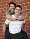 TikTok personalities Ian Paget, left, and Chris Olsen pose for a portrait in West Hollywood, Calif. on Oct. 20, 2020. Paget and Olsen, gay partners in Los Angeles, have amassed more than 4 million followers who love and encourage them as they hunker down at home, churning out goofy dance videos and playing the constant pranks that are stock-in-trade on TikTok. (AP Photo/Chris Pizzello)