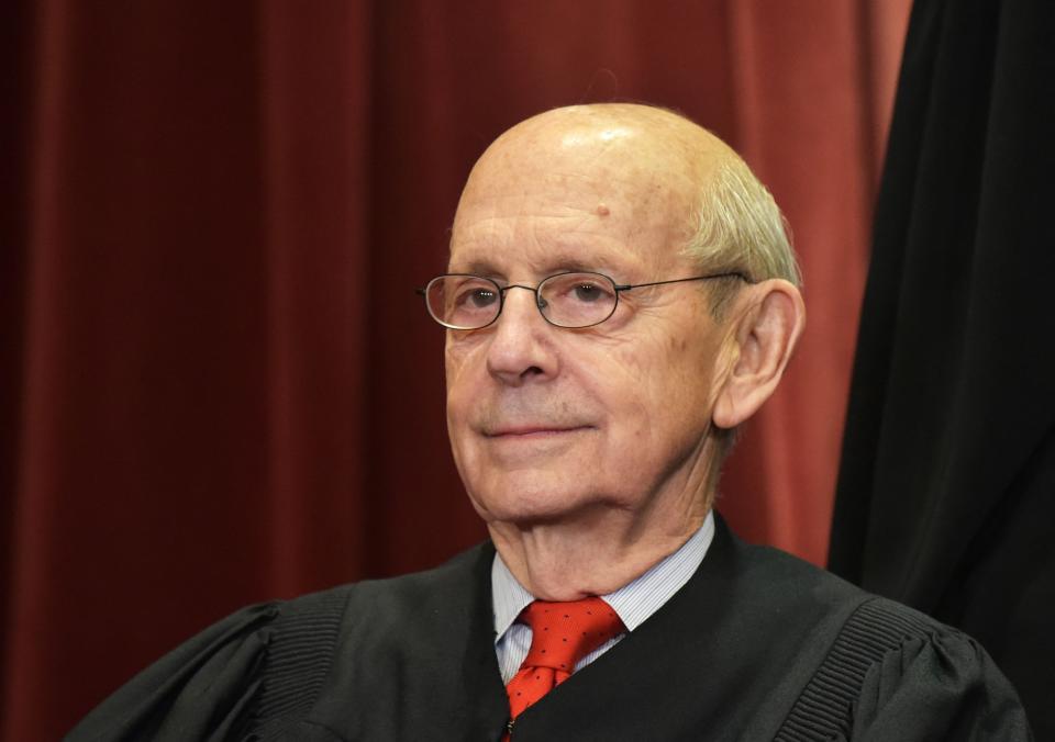 Associate Justice Stephen Breyer poses for the official group photo at the U.S. Supreme Court in Washington in 2018. Breyer announced on Jan. 26, 2022, that he would retire from the court.