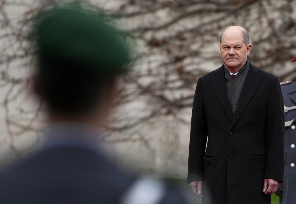 German Chancellor Olaf Scholz waits for Ireland's Prime Minister Micheal Martin at the chancellery in Berlin, Germany, Tuesday, Feb. 22, 2022. (AP Photo/Michael Sohn)