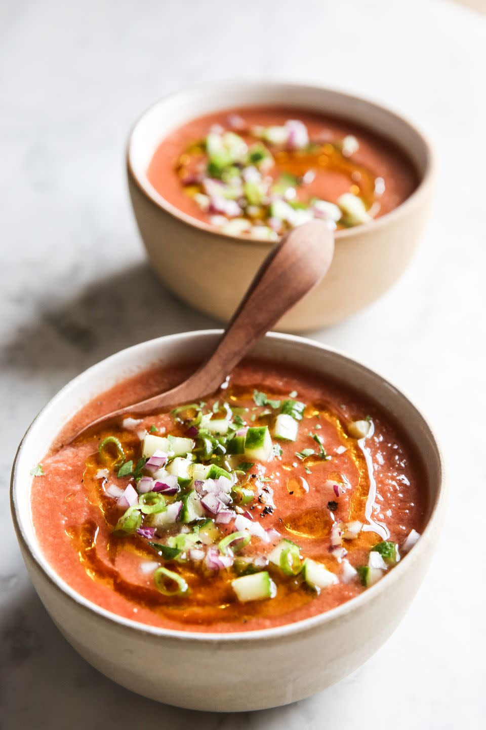 <p>Plum tomatoes, cucumbers, and red onion come together with white vinegar, garlic, and olive oil to make this super easy and delicious summer soup. Garnish with green onions, a swirl of olive oil, and plenty of freshly ground black pepper for a restaurant-level presentation.</p><p>Get the <strong><a href="https://www.delish.com/cooking/recipe-ideas/a27794655/easy-gazpacho-soup-recipe/" rel="nofollow noopener" target="_blank" data-ylk="slk:Gazpacho recipe;elm:context_link;itc:0;sec:content-canvas" class="link ">Gazpacho recipe</a>.</strong></p>