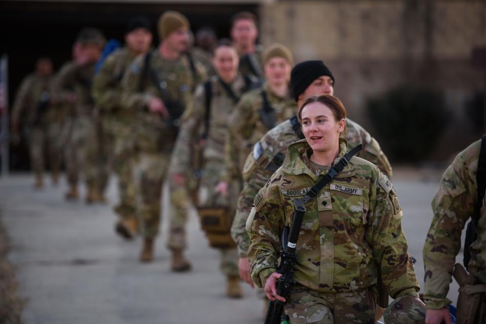 U.S. service members deploy to Poland on Feb. 14, 2022, from Fayetteville, N.C.