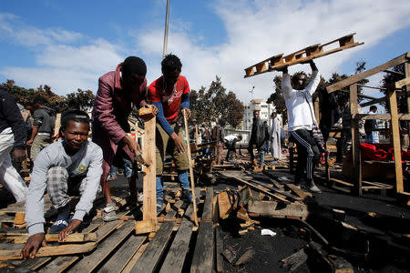 African migrants build a makeshift house after their houses burned, on the outskirts of Casablanca, Morocco October 29, 2018. REUTERS/Youssef Boudlal