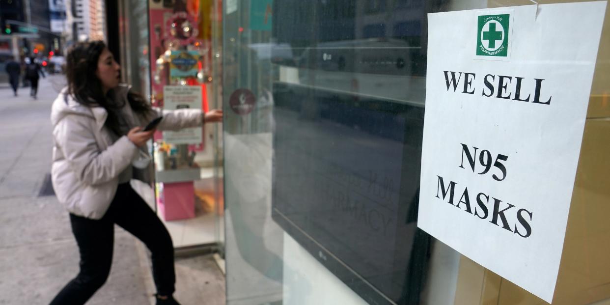 A woman walks into a pharmacy to purchase N95 face masks in advance of the potential coronavirus outbreak in the Manhattan borough of New York City, New York, U.S., February 27, 2020. REUTERS/Carlo Allegri