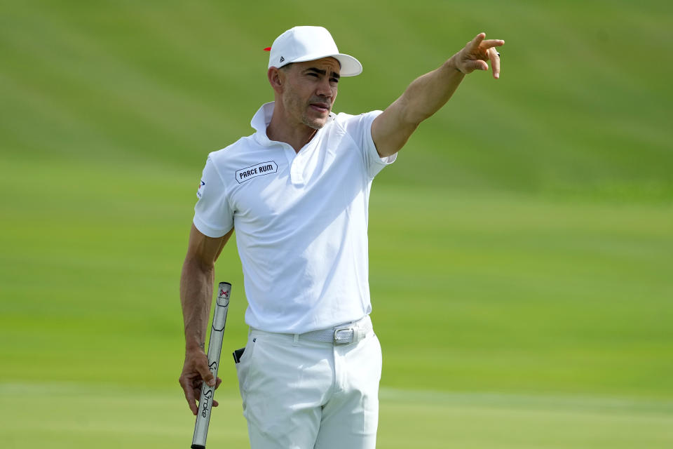 Camilo Villegas motions on the 18th green during the first round of The Sentry golf event, Thursday, Jan. 4, 2024, at Kapalua Plantation Course in Kapalua, Hawaii. (AP Photo/Matt York)