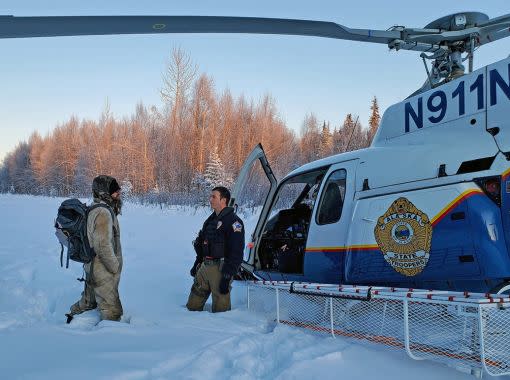 Tyson Steele is greeted by Alaska State Trooper's tactical flight officer Zac Johnson after more than 20 days in the wilderness. (Photo: Alaska DPS)