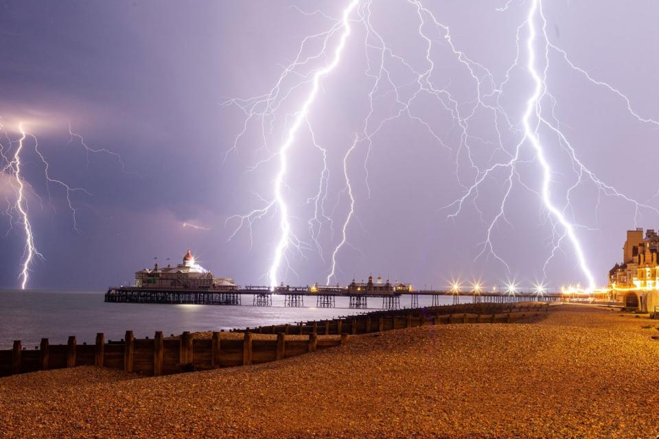 Lightning strikes lit up parts of the south-east overnight as thunderstorms and torrential rain lashed the UK. Parts of Britain were hit by a "spectacular electrical storm", with seaside town Eastbourne in East Sussex said to have seen about 1,000 lightning strikes in an hour. Homes were left without power and roads were flooded in other parts of south-east England while Lenham, Kent, was hit by 42mm of rain in just 60 minutes late on Tuesday.A yellow weather warning for thunderstorms remains in place for most of the south-east until 9pm on Wednesday, with forecasters warning that further rain, hail and lightning could bring yet more disruption.However, Met Office meteorologist Oli Claydon told the Standard the most dramatic weather was over for this week.“We’re keeping the yellow weather warning in place, but the highest impact conditions should have subsided,” he said.“Thundery showers will push north-eastwards across the country, but things will start to clear up in the south-east. We might even see some sunny spells in and around London by the end of the day on Wednesday.”The flood-hit community of Wainfleet, Lincolnshire, is within the Met Office's warning area, but Mr Diamond said the town should suffer little more than a few scattered showers.“It won’t see anything like the intensity of last week, and we don’t expect any more thunderstorms there for now,” he said.Around 225 Olympic-sized swimming pools' worth of water were pumped out to sea on Monday, following severe flooding in the area.Nearly 600 homes had to be evacuated in and around Wainfleet after the River Steeping burst its banks on Tuesday, June 11, with residents still unable to return home.The rest of this week should see increasingly bright conditions, with temperatures reaching 20C to 21C in the South East on Thursday.“Things will feel notably more pleasant across the UK,” said Mr Diamond, “With London and many parts of the south east enjoying some more sunshine.“Moving into the weekend there will be some scattered and light showers, particularly in coastal areas of Scotland, but Friday will be a largely dry and bright day in many parts of England, Wales and Northern Ireland.”The forecaster warned that while temperatures could hit 22C to 23C in the South East on Saturday, more changeable weather will return on Sunday.“A band of rain will push across from the South West, bringing cooler wetter conditions on Sunday evening.“We can’t know for sure at this stage how this will develop into next week."