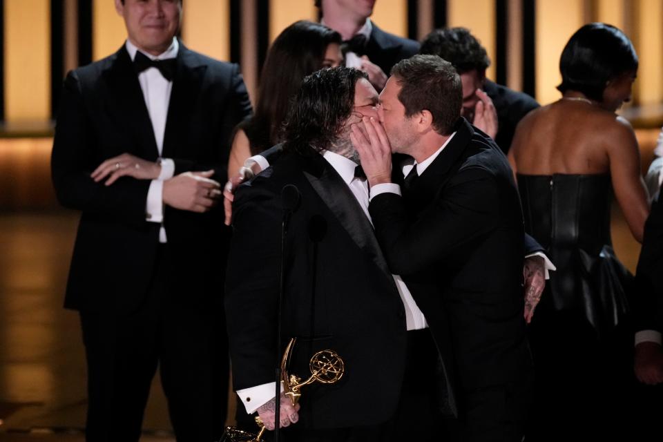 Ebon Moss-Bachrach (right) kisses Matty Matheson as he accepts the award for best comedy series for ‘The Bear’ during the 75th Emmy Awards.