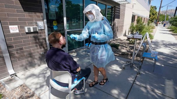 PHOTO: Clay Harris receives a COVID-19 test outside the Salt Lake County Health Department, on July 22, 2022, in Salt Lake City. (Rick Bowmer/AP)