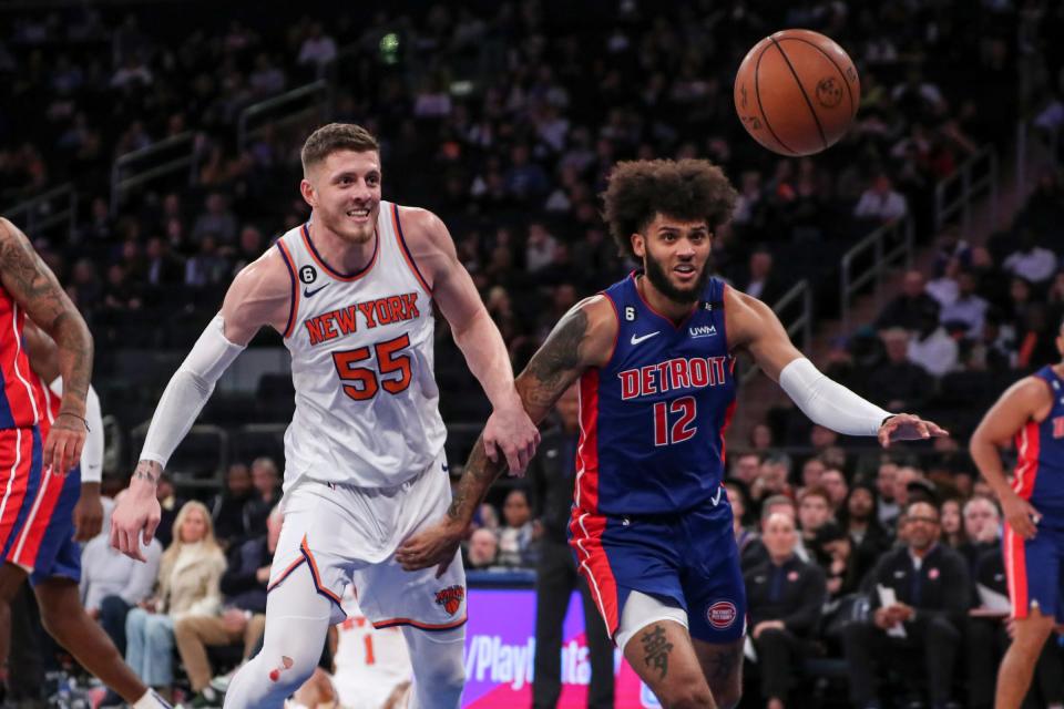 Knicks center Isaiah Hartenstein and Pistons forward Isaiah Livers chase after a loose ball in the fourth quarter of the Pistons' 117-96 preseason loss to the Knicks on Tuesday, Oct. 4, 2022, in New York City.