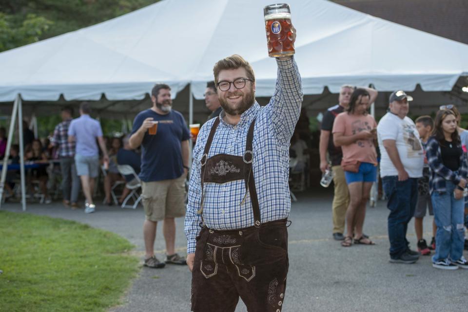 Covington's Oktoberfest runs Sept. 8-10 this year at Goebel Park in Mainstrasse. Pictured: Matt Angerer of Covington with a large mug of Braxton Oktoberfest Fuel.