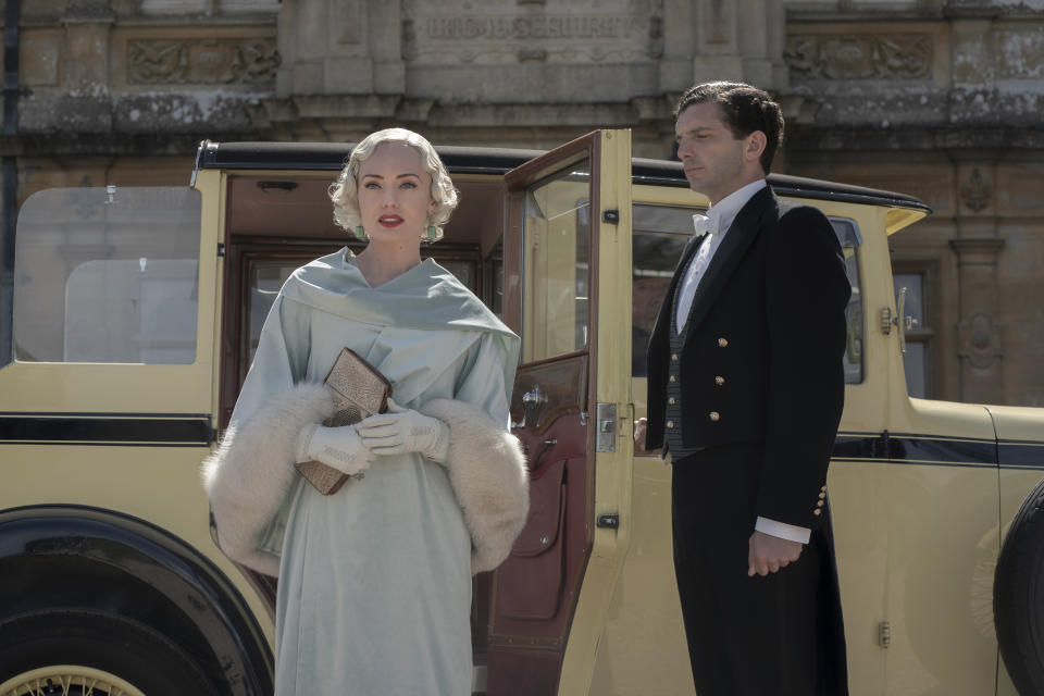 This image released by Focus Features shows Laura Haddock, left, and Michael Fox in a scene from "Downton Abbey: A New Era." (Ben Blackall/Focus Features via AP)