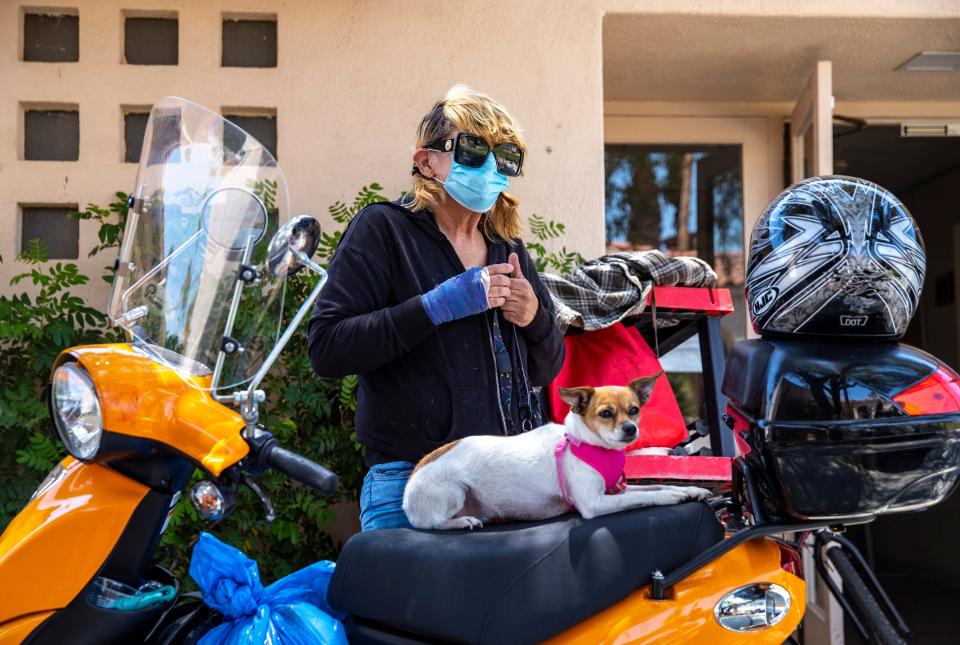 Christina Barrington with her dog, Little Biscuit Rose, at Church of St. Paul In the Desert in Palm Springs on Wednesday.