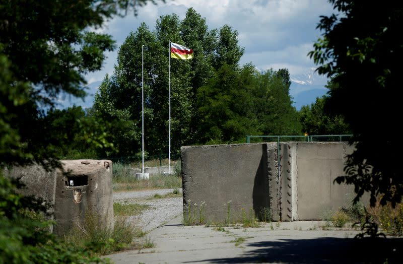 FILE PHOTO: An Ossetian flag is seen on the closed road at the de facto border of Georgia's breakaway region of South Ossetia in Ergneti