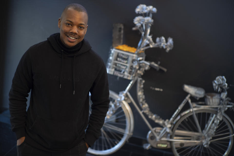 Michael Musandu, a co-founder and CEO of AI fashion company Lalaland.ai, poses for a portrait in Amsterdam, Netherlands, Friday, March 8, 2024. In March 2023, iconic denim brand Levi Strauss & Co. announced that it would be testing AI-generated models produced by the Amsterdam-based company to add a wider range of body types and underrepresented demographics on its website. (AP Photo/Peter Dejong)