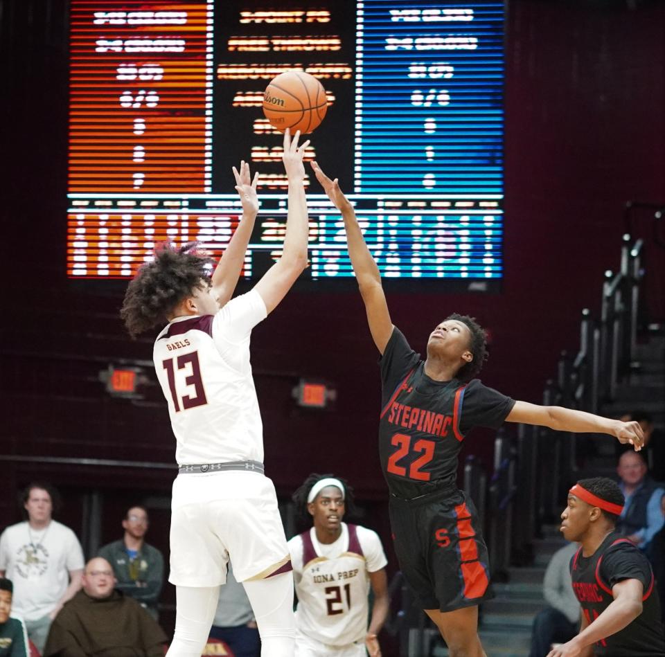 Iona Prep's A.J. Rodriguez (13) shoots over Stepinac's Hassan Koureissi during the Gaels' 44-42 win over Stepinac at Iona University on Feb. 11, 2023.