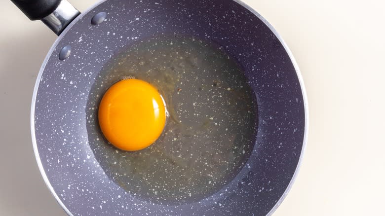 raw egg in pan