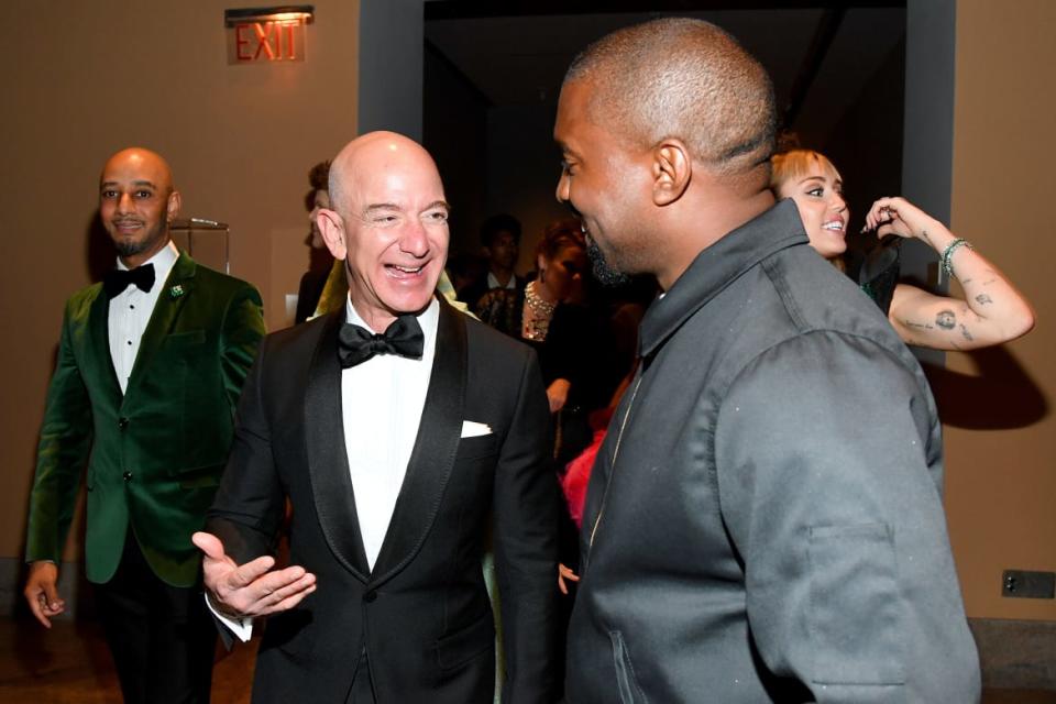 Jeff Bezos and Kayne West laugh at the 2019 Met Gala