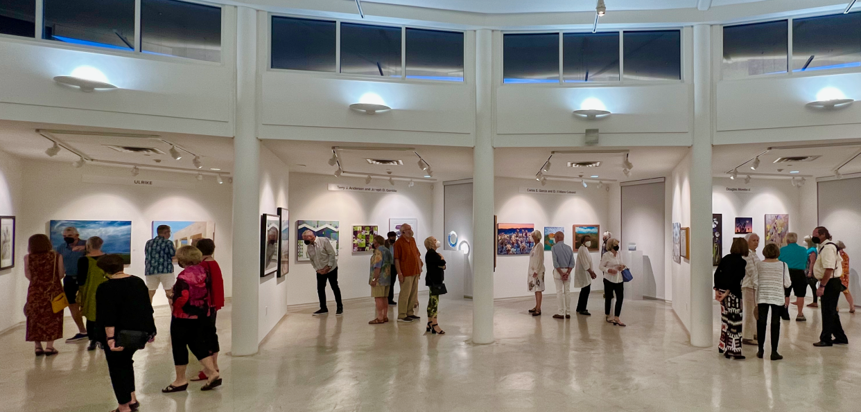 Guests mingle at the Artists Council's opening reception in the galleries at Artists Center at the Galen 2022.