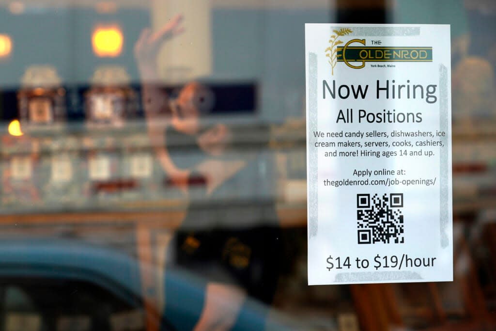 FILE – A sign advertises for help The Goldenrod, a popular restaurant and candy shop, Wednesday, June 1, 2022, in York Beach, Maine. America’s hiring boom continued in July as employers added a surprising 528,000 jobs despite raging inflation and rising anxiety about a recession. (AP Photo/Robert F. Bukaty)