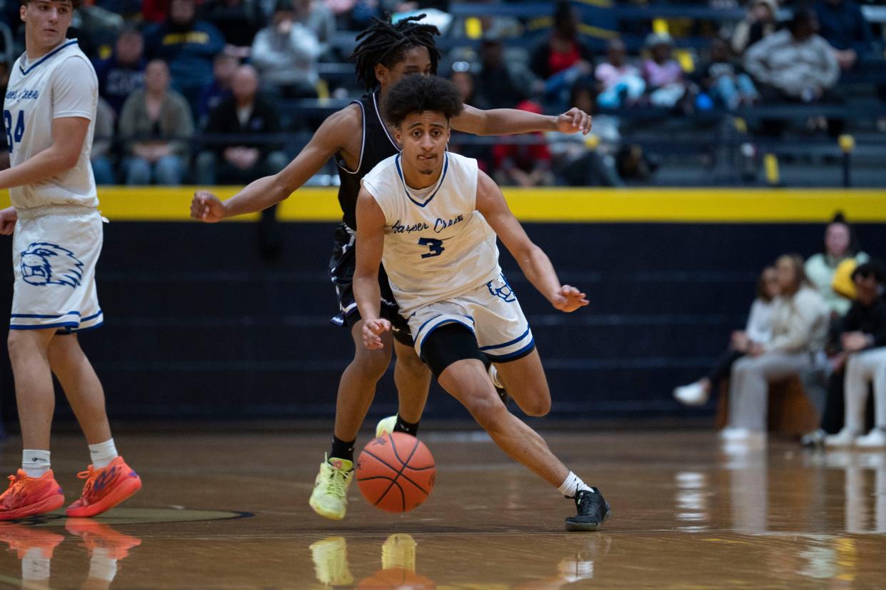 Harper Creek senior KeyShaun Matthews dribbles during a game against Lakeview at Battle Creek Central High School on Wednesday, March 8, 2023.