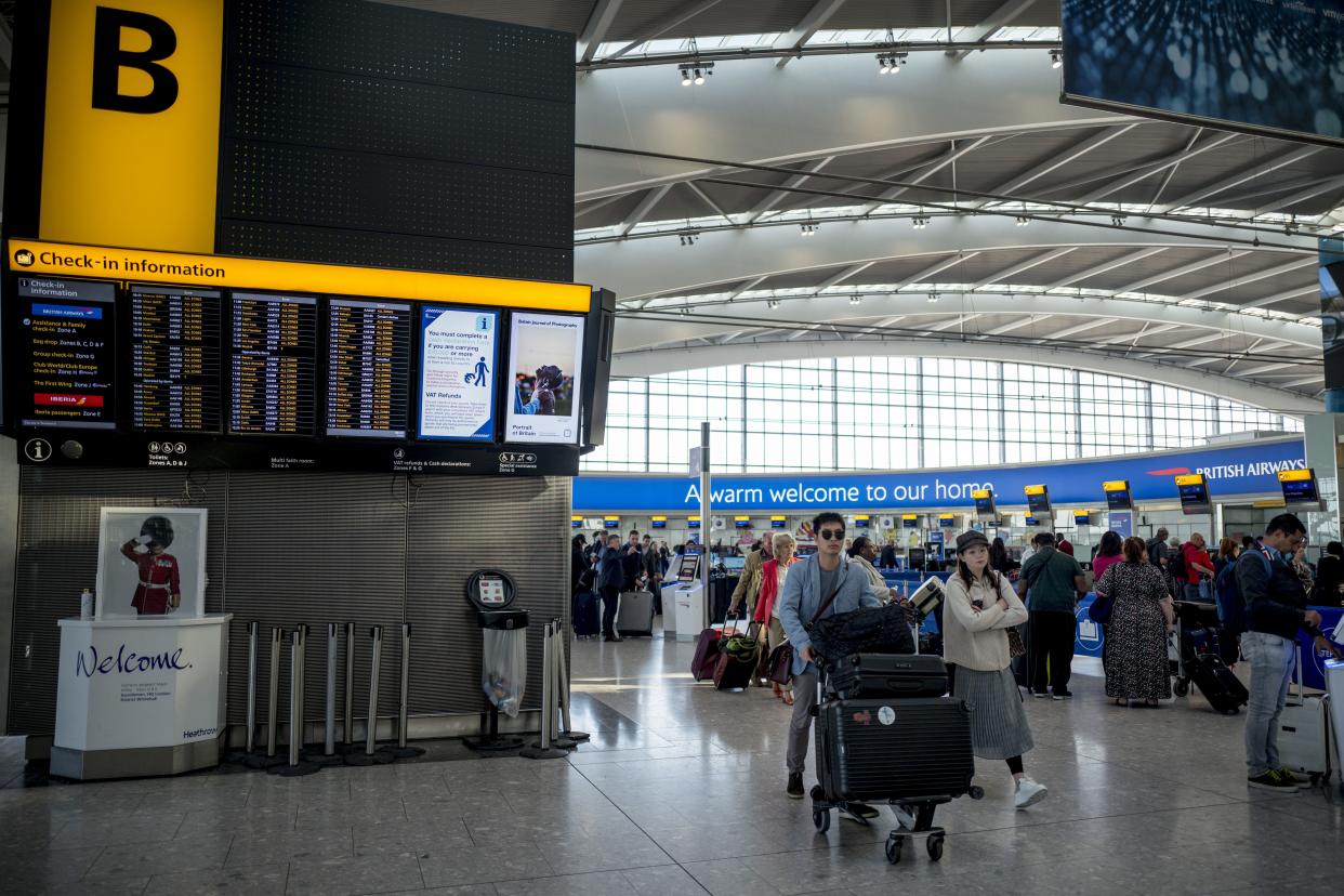 Passengers queue to check-in for their flights at Heathrow Airport's Terminal 5 in west London, on September 13, 2019. - British Airways has cancelled all its scheduled UK flights for September 27, when company pilots will again strike in a long-running row over pay. (Photo by Tolga Akmen / AFP)        (Photo credit should read TOLGA AKMEN/AFP/Getty Images)