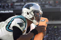 <p>Carolina Panthers quarterback Cam Newton kisses the pylon after tripping over it while celebrating a touchdown pass to tight end Greg Olsen during the second half of an NFL football game against the Philadelphia Eagles, Sunday, Oct. 21, 2018, in Philadelphia. (AP Photo/Matt Rourke) </p>