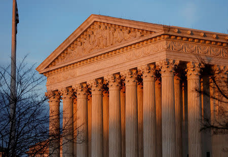 FILE PHOTO: Light from the setting sun shines on the U.S. Supreme Court in Washington, DC, U.S., January 20, 2018. REUTERS/Joshua Roberts/File Photo
