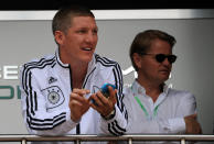 German national football team player Bastian Schweinsteiger is pictured during a visit to the Mercedes stand in the pits at the Circuit de Monaco on May 27, 2012 in Monte Carlo during the Monaco Formula One Grand Prix. (DIMITAR DILKOFFDIMITAR DILKOFF/AFP/GettyImages)