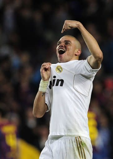 Real Madrid's defender Pepe celebrates after winning the Spanish League "El Clasico" football match against Barcelona at the Camp Nou stadium in Barcelona. Real Madrid won 2-1