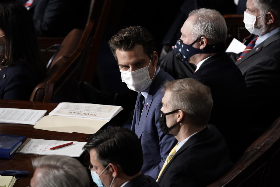 FILE - In this Jan. 6, 2021, file photo President Donald Trump allies Rep. Matt Gaetz, R-Fla., flanked by Rep. Jim Jordan, R-Ohio, and Rep. Steve Scalise, R-La., sit in the House chamber during a joint session of the House and Senate to count the Electoral College votes cast in November's election, at the Capitol in Washington. (AP Photo/J. Scott Applewhite, Pool, File)