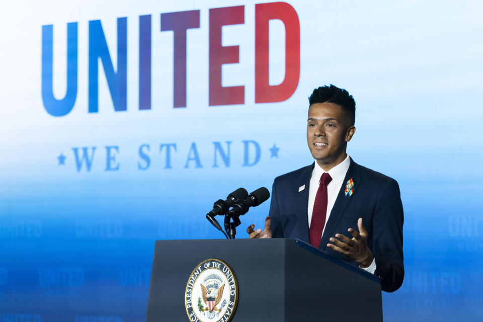 Pulse shooting survivor Brandon Wolf introduces Vice President Kamala Harris during the United Against Hate Summit, Thursday, Sept. 15, 2022, in the East Room of the White House in Washington. (AP Photo/Jacquelyn Martin)