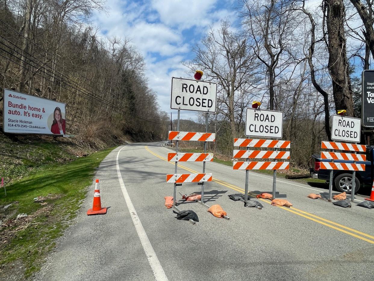 'Road closed' signs are posted at the upper end of the closed section of route 403, near Greenhouse Park.