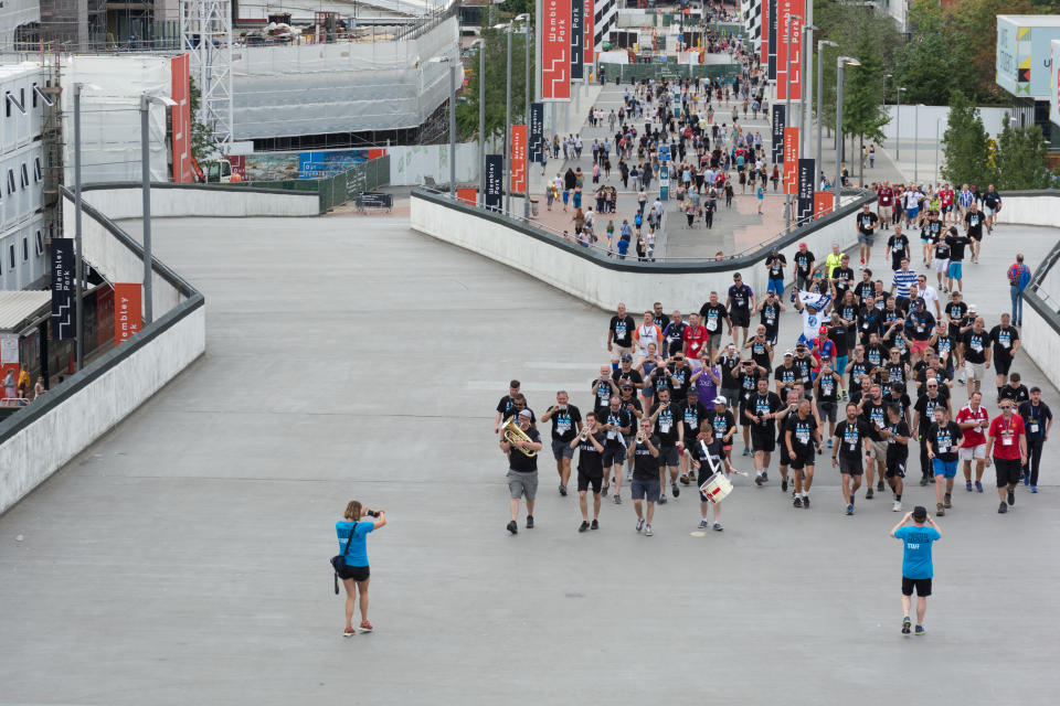 Photo finish: the marchers end their mission at the national stadium