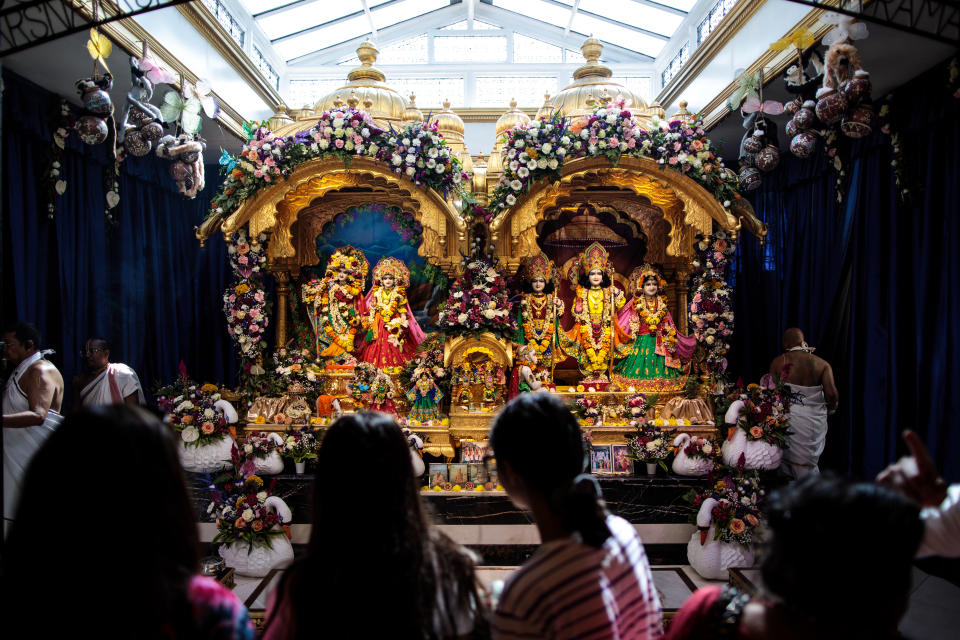 <p>Devotees pray at a shrine during the Janmashtami festival at Bhaktivedanta Manor on September 2, 2018 in Watford, England. (Photo by Jack Taylor/Getty Images) </p>