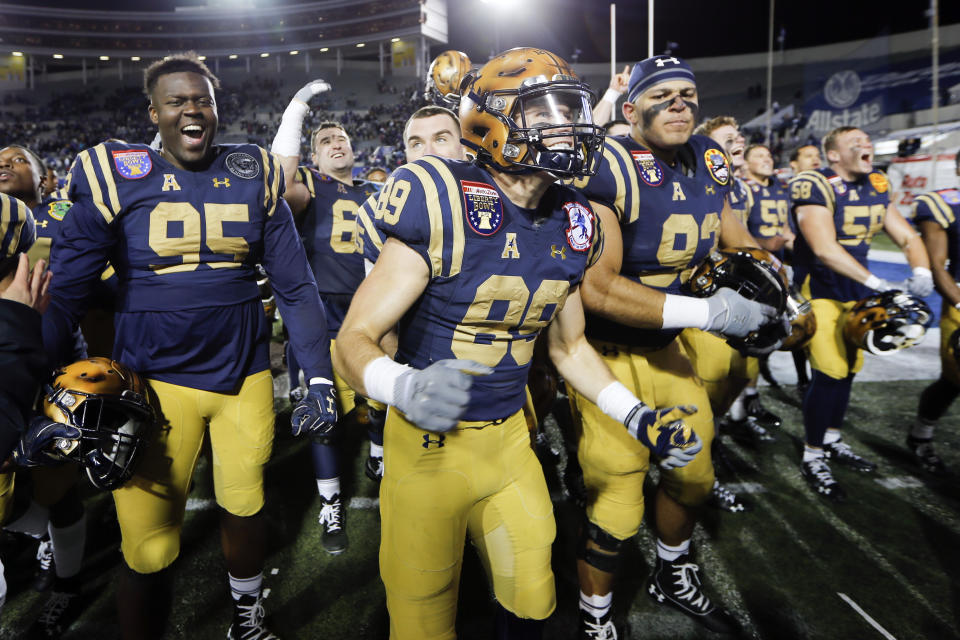 Navy players celebrate after beating Kansas State in the Liberty Bowl NCAA college football game Tuesday, Dec. 31, 2019, in Memphis, Tenn. Navy won 20-17. (AP Photo/Mark Humphrey)