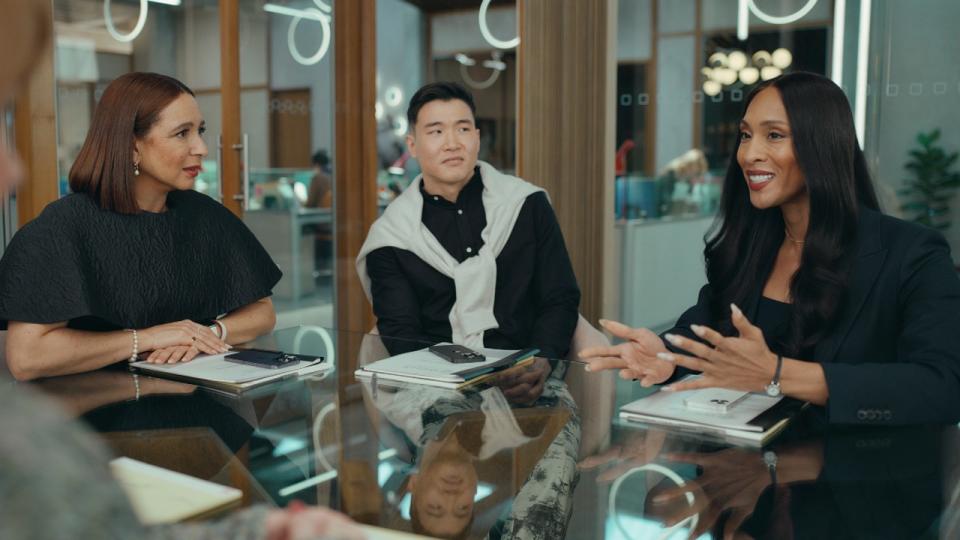 Maya Rudolph, Joel Kim Booster and Michaela Jaé Rodriguez sitting at a table in 