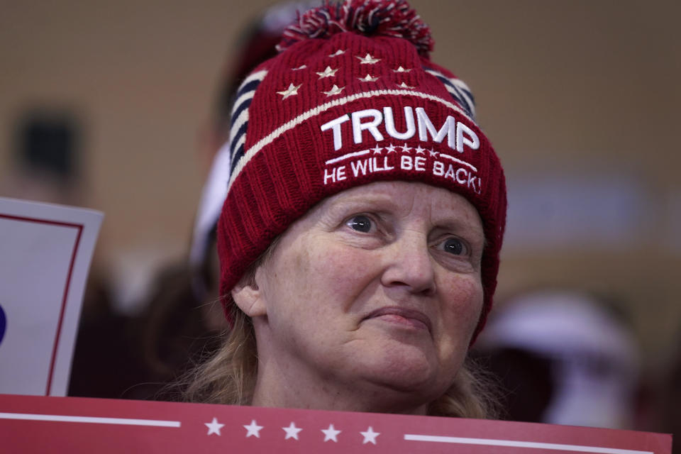 A supporter listens to former President Donald Trump speak during a commit to caucus rally, Saturday, Oct. 7, 2023, in Waterloo, Iowa. (AP Photo/Charlie Neibergall)