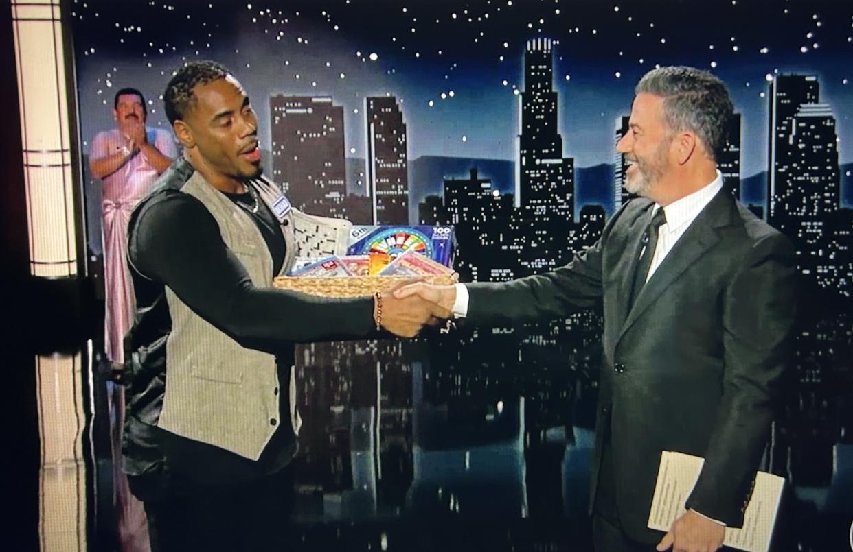 Rashad Jennings accepts his basket of prizes from Jimmy KImmel.