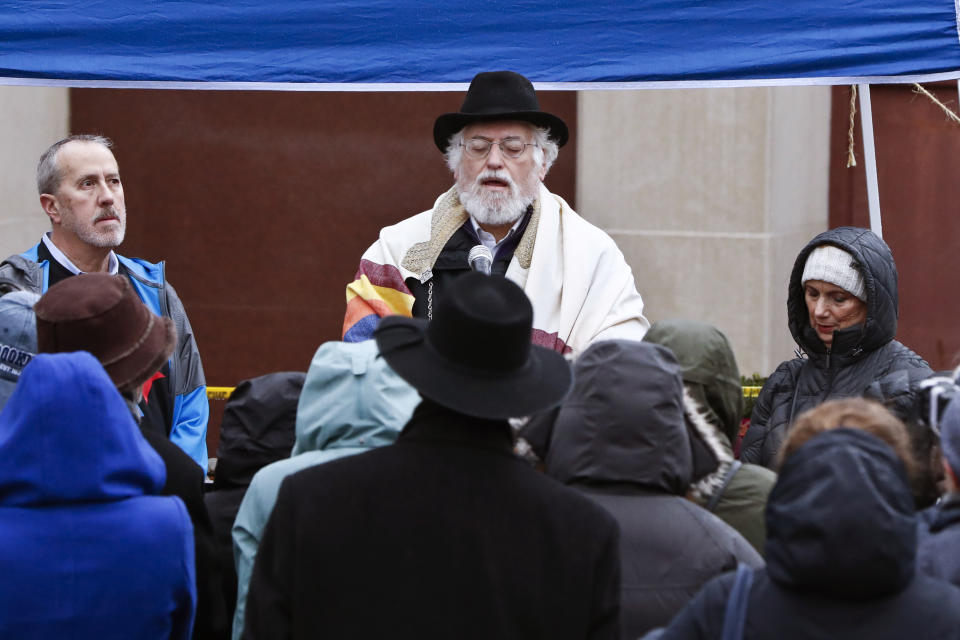 Former Tree of Life rabbi Chuck Diamond leads a service outside the Tree of Life Synagogue on Saturday, Nov. 3, 2018, in Pittsburgh. Eleven people were killed and six others injured in a shooting during services there a week ago. (AP Photo/Keith Srakocic)