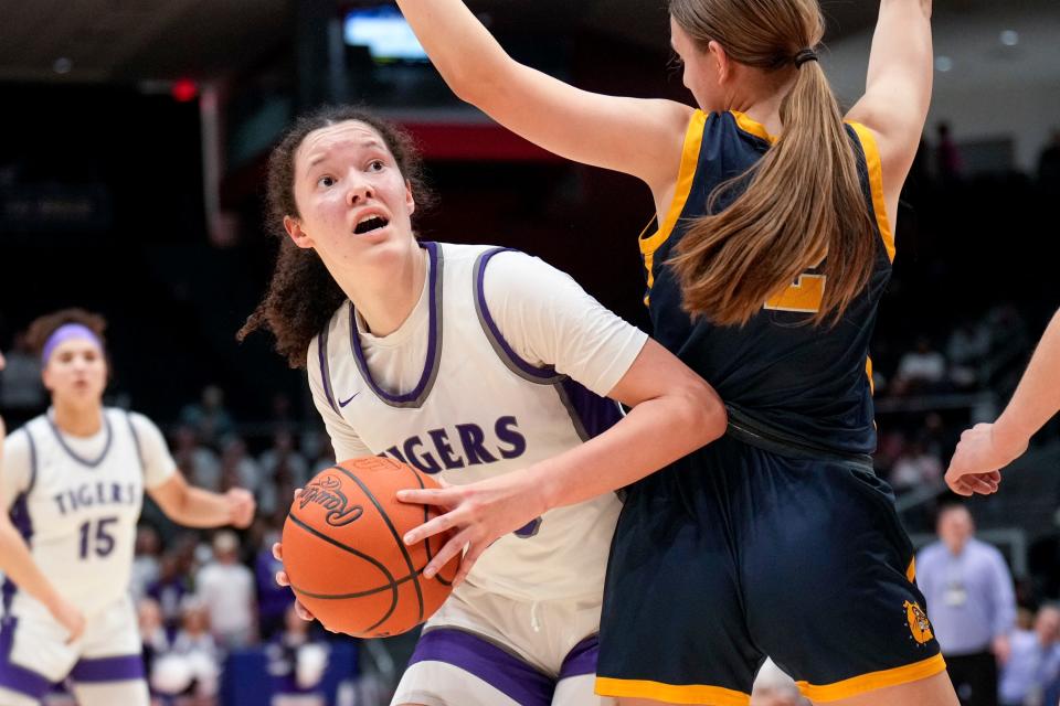 Pickerington Central's Berry Wallace drives around Olmsted Falls' Danielle Cameron during a Division I state semifinal last year.