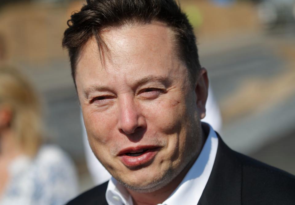 Tesla CEO Elon Musk talks to media as he arrives to visit the construction site of the future US electric car giant Tesla, on September 03, 2020 in Gruenheide near Berlin. - Tesla builds a compound at the site in Gruenheide in Brandenburg for its first European 