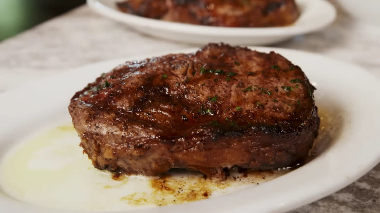 Cowboy ribeye in melted butter