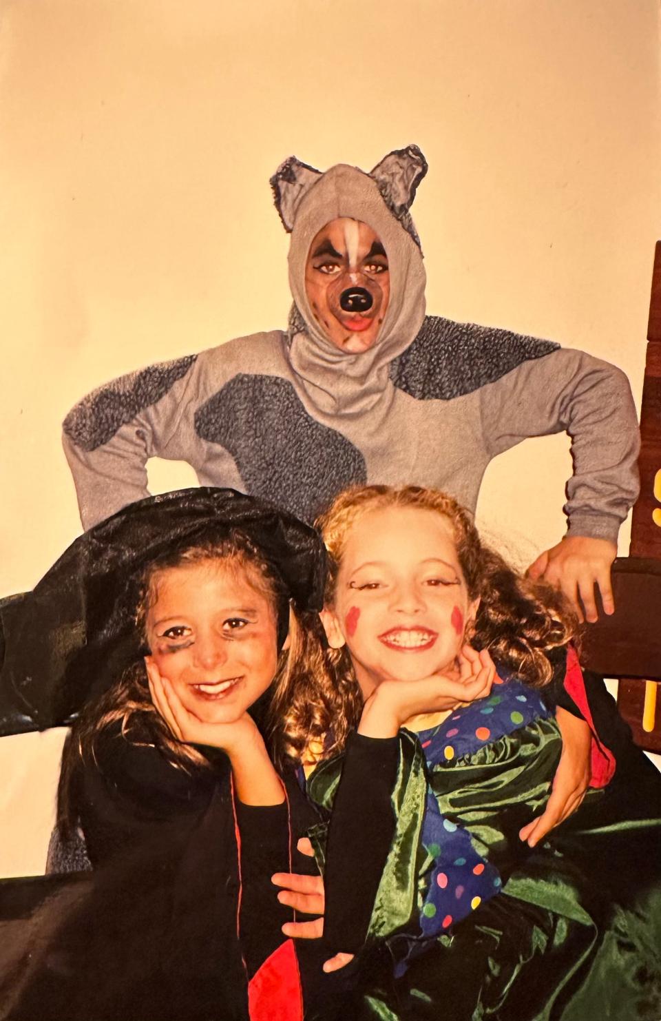 A young Erik Scott Romney poses with his "The Wizard of Oz" castmates in his Toto costume in 1996 in Redding, Calif.