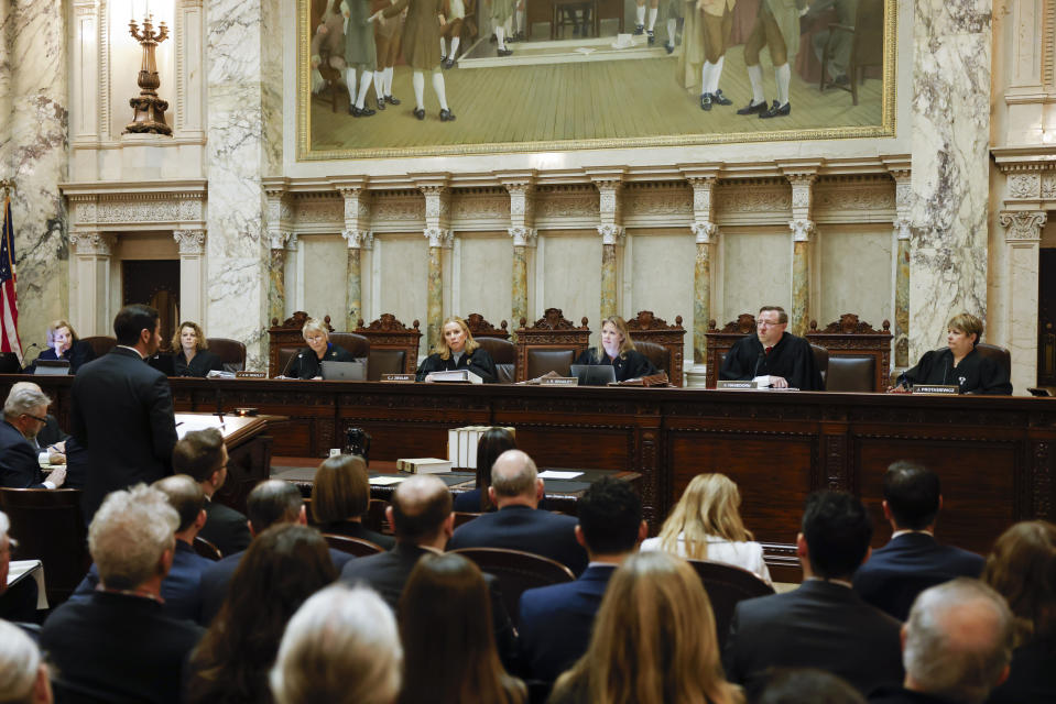 FILE - The Wisconsin Supreme Court listens to arguments from Wisconsin Assistant Attorney General Anthony D. Russomanno, representing Gov. Tony Evers, during a redistricting hearing at the state Capitol, Nov. 21, 2023, in Madison, Wis. (Ruthie Hauge/The Capital Times via AP, Pool, File)