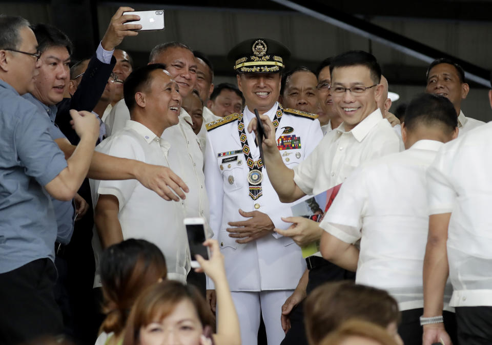 FILE - In this Sept. 24, 2019, file photo, new Philippine Armed Forces chief Lt.Gen. Noel Clement, center, poses with his batchmates at the Philippine Military Academy prior to the change of command ceremony in Manila, Philippines. Despite new South China Sea tensions between Manila and Bejing, Clement says the chance of an armed conflict breaking out between the sides remains very low. (AP Photo/Bullit Marquez, File)