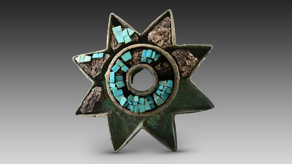 At least seven elite tombs have been found at the Zhaigou site since excavations started in June 2022. This bronze star inlaid with turquoise is among the hundreds of artifacts found there.