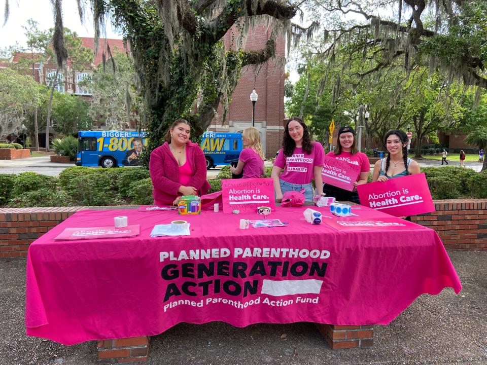 A local Planned Parenthood group set up a table in opposition to the anti-abortion group Created Equal's displays on UF campus on March 10, 2023.