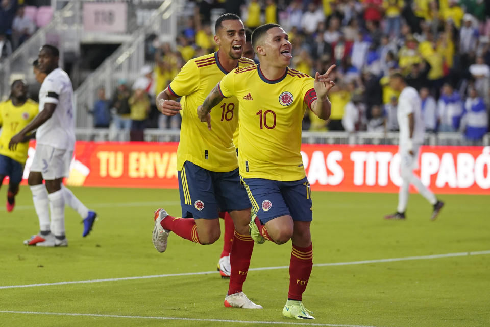 FILE - Colombia's Juan Fernando Quintero right center, celebrates with Daniel Giraldo after scoring a goal during the first half of an international friendly soccer match against Honduras, in Fort Lauderdale, Fla, Jan. 16, 2022. Colombia faces Bolivia on Thursday, March 24, 2022 in the penultimate round of the South American qualifiers for the Qatar World Cup. (AP Photo/Lynne Sladky, File)