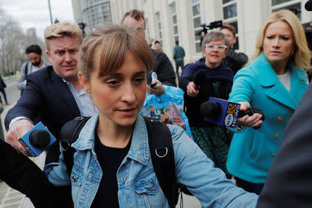 Actress Allison Mack, known for her role in the TV series "Smallville", departs after being granted bail following being charged with sex trafficking and conspiracy in New York, U.S., April 24, 2018. REUTERS/Lucas Jackson