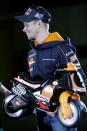 World MotoGP Champion Casey Stoner from Australia, receives a present for his recently born son before the presentation of the Repsol Honda Moto GP Team at the 'Palacio de los Deportes' in Madrid, Spain on Saturday, March 3, 2012.